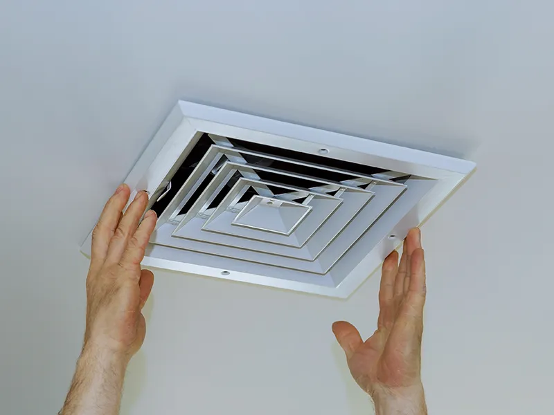 close-up-man-hand-installing-vent-cover-from-ceiling